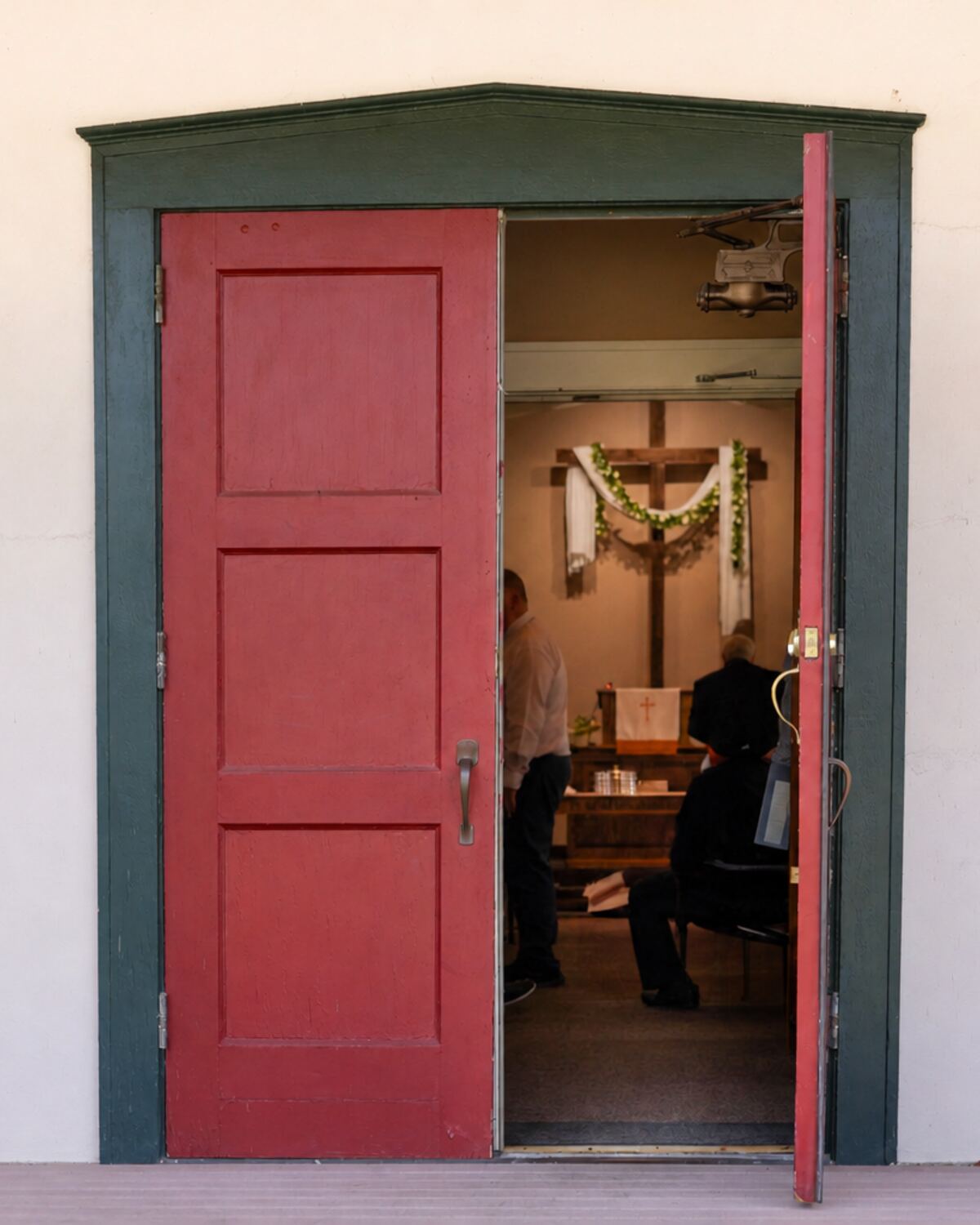 The open red door of Faith Reformed Church in Erie, PA